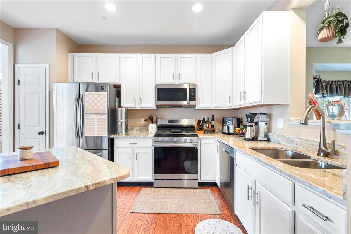 1729 Emory Street Frederick, MD 21701 - Photo 4 of 50 a kitchen with a sink stove and refrigerator