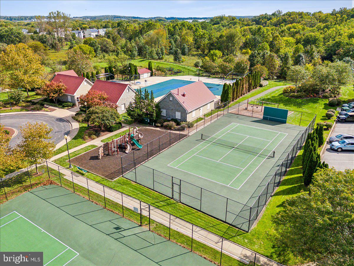 1729 Emory Street Frederick, MD 21701 - Photo 41 of 50 a view of a tennis ground with large trees
