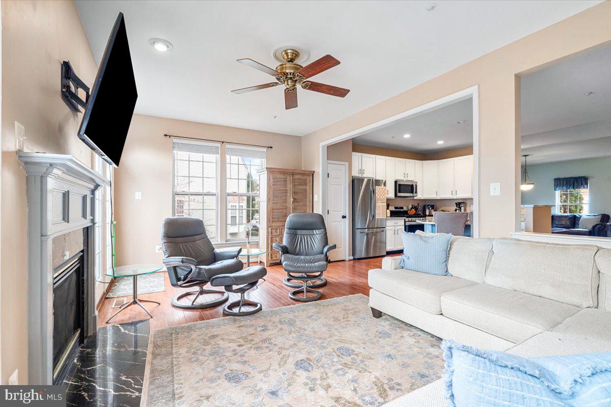 1729 Emory Street Frederick, MD 21701 - Photo 8 of 50 a living room with furniture fireplace and a flat screen tv