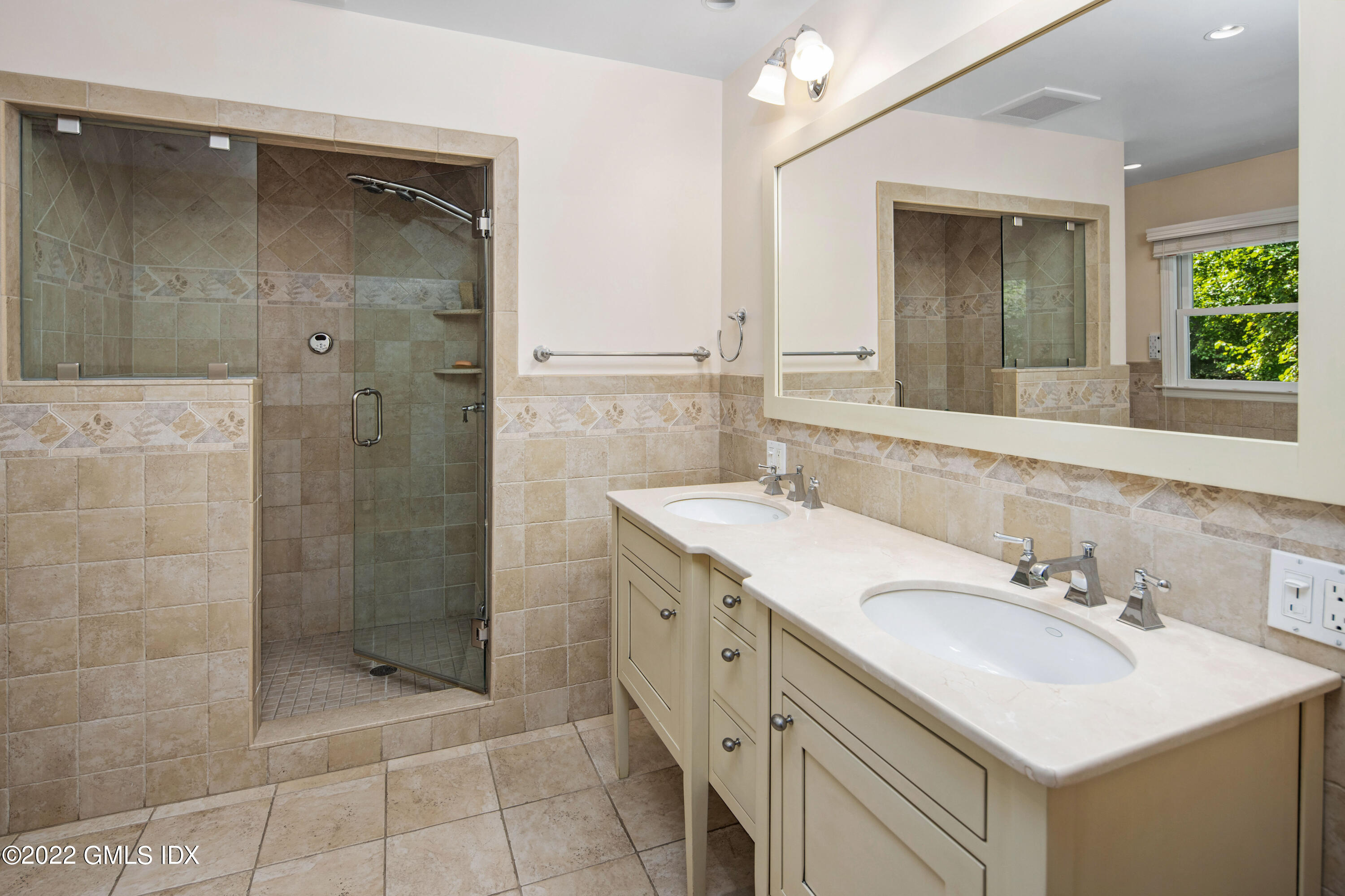 27 Rustic View Road Greenwich, CT 06830 - Photo 14 of 37 a bathroom with a shower sink and mirror