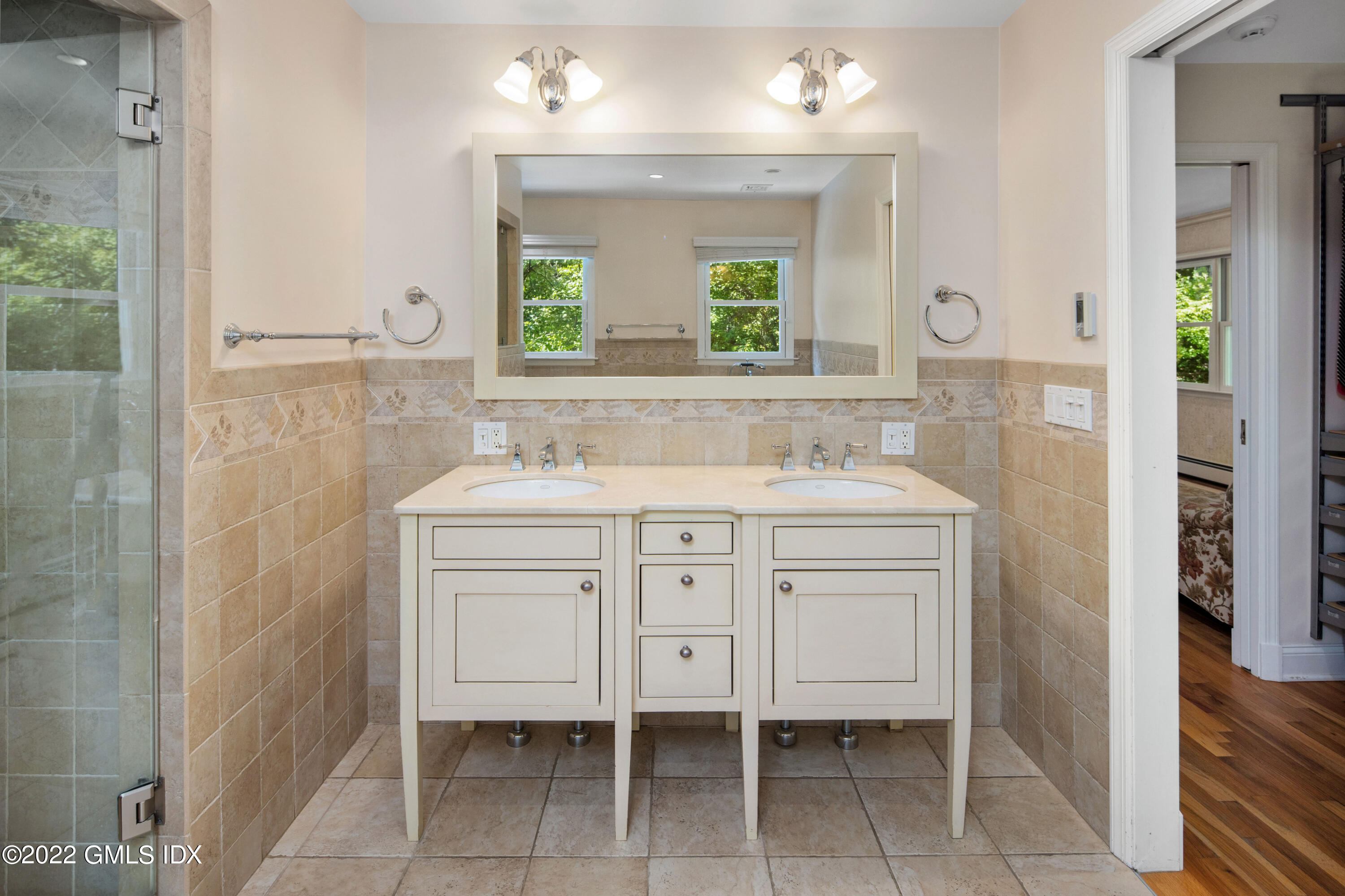 27 Rustic View Road Greenwich, CT 06830 - Photo 15 of 37 a bathroom with a sink shower and a mirror