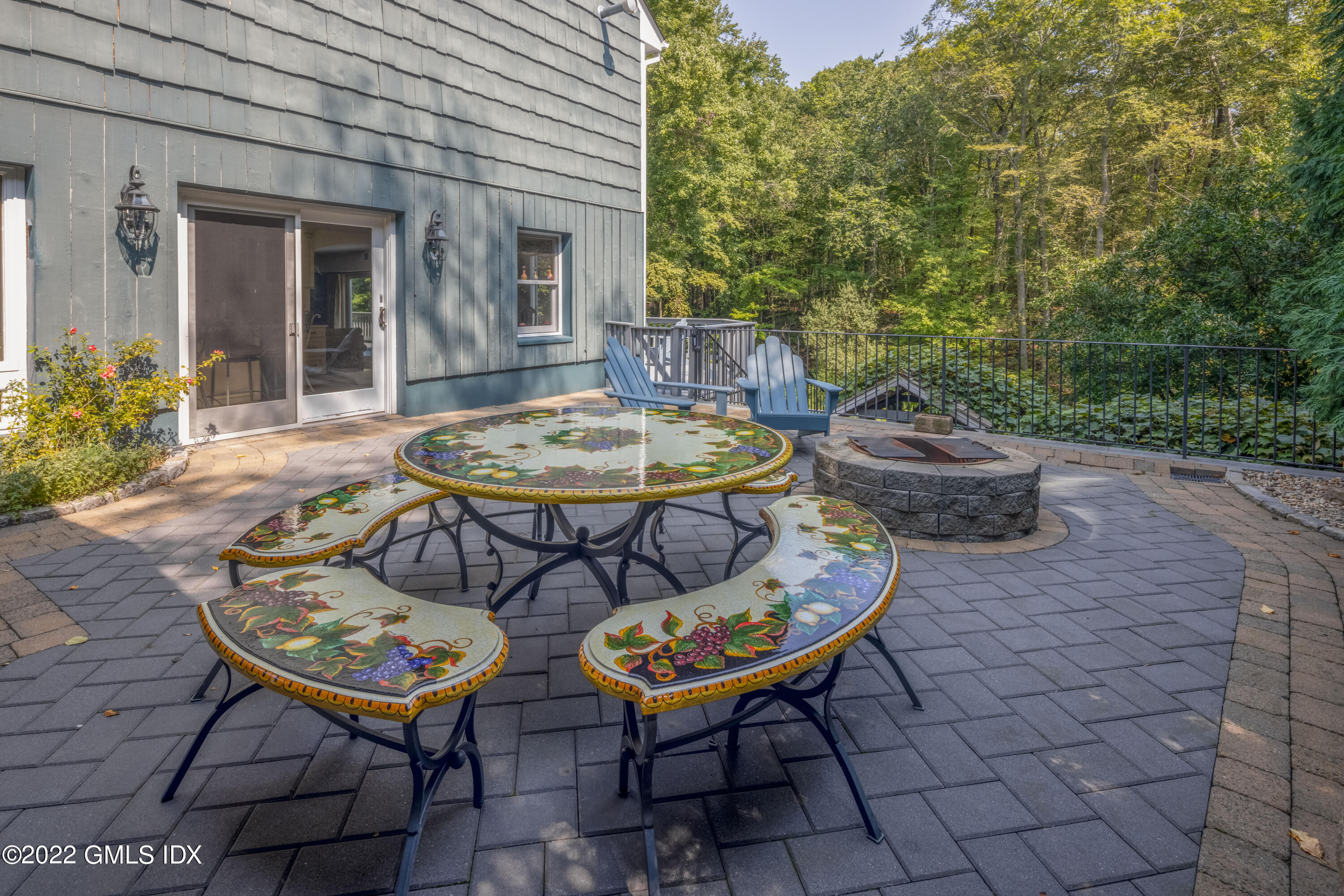 27 Rustic View Road Greenwich, CT 06830 - Photo 22 of 37 a view of a backyard with furniture and a table