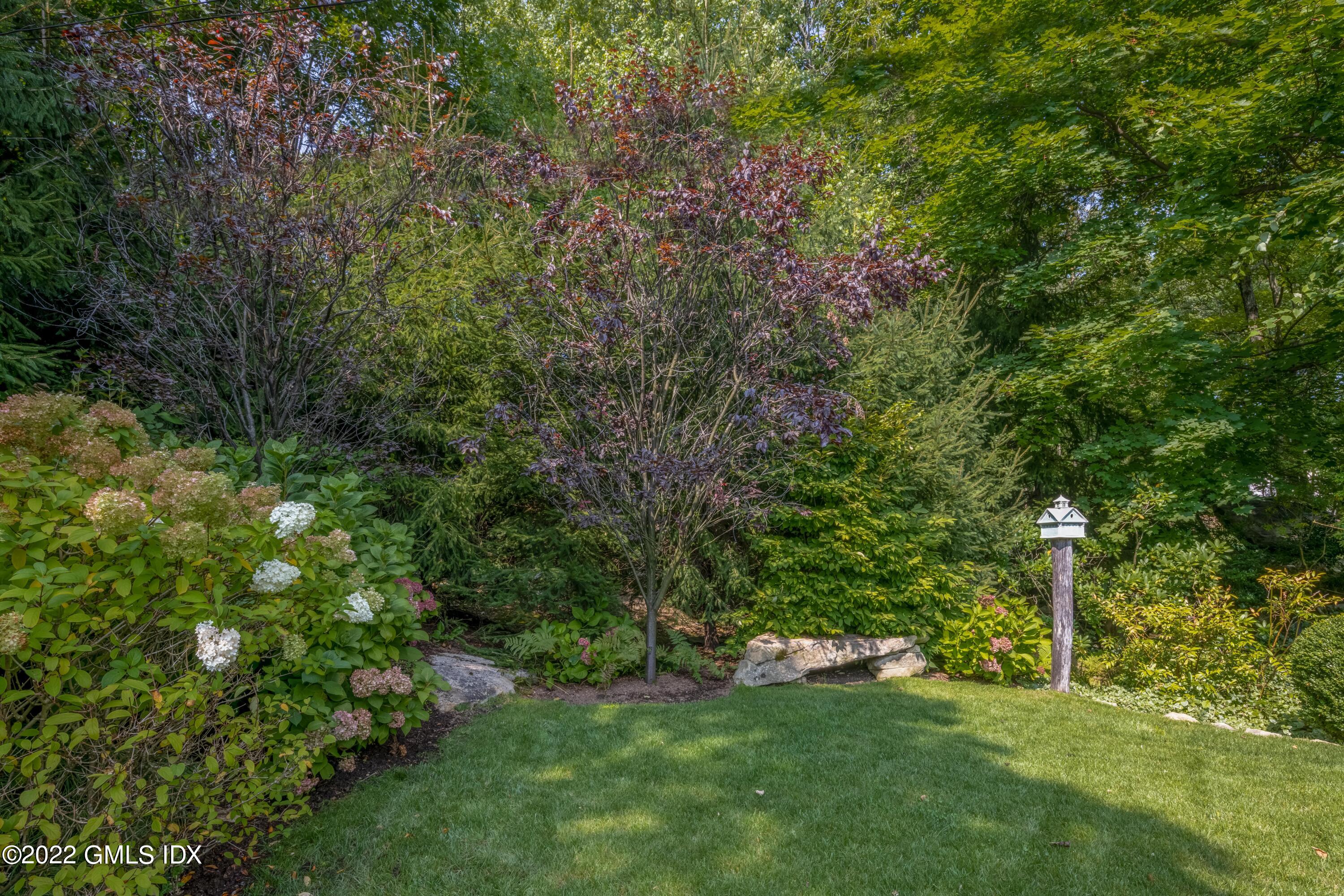 27 Rustic View Road Greenwich, CT 06830 - Photo 27 of 37 a view of a field with a tree