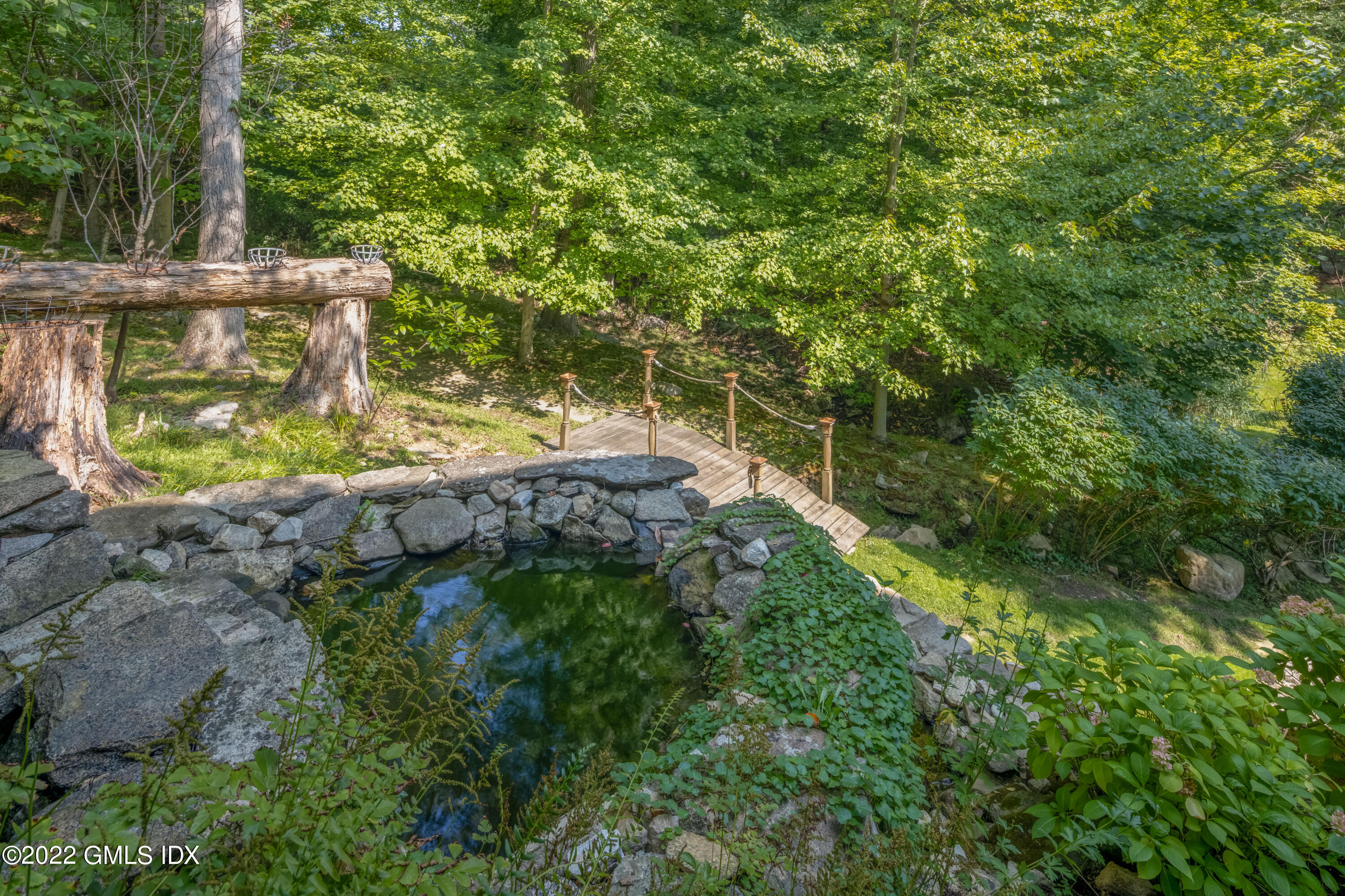 27 Rustic View Road Greenwich, CT 06830 - Photo 28 of 37 a view of a garden with plants