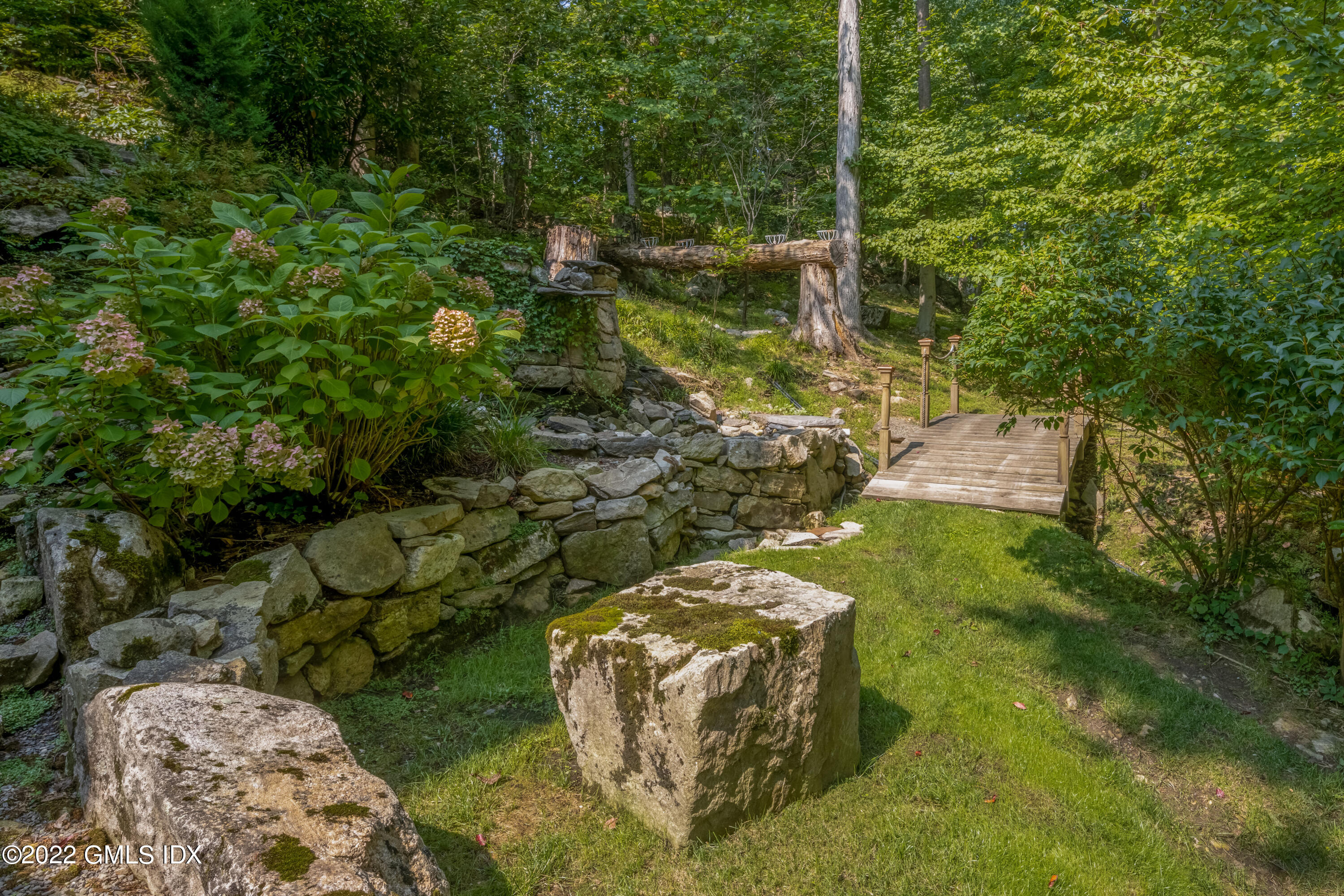 27 Rustic View Road Greenwich, CT 06830 - Photo 29 of 37 a view of a garden with plants