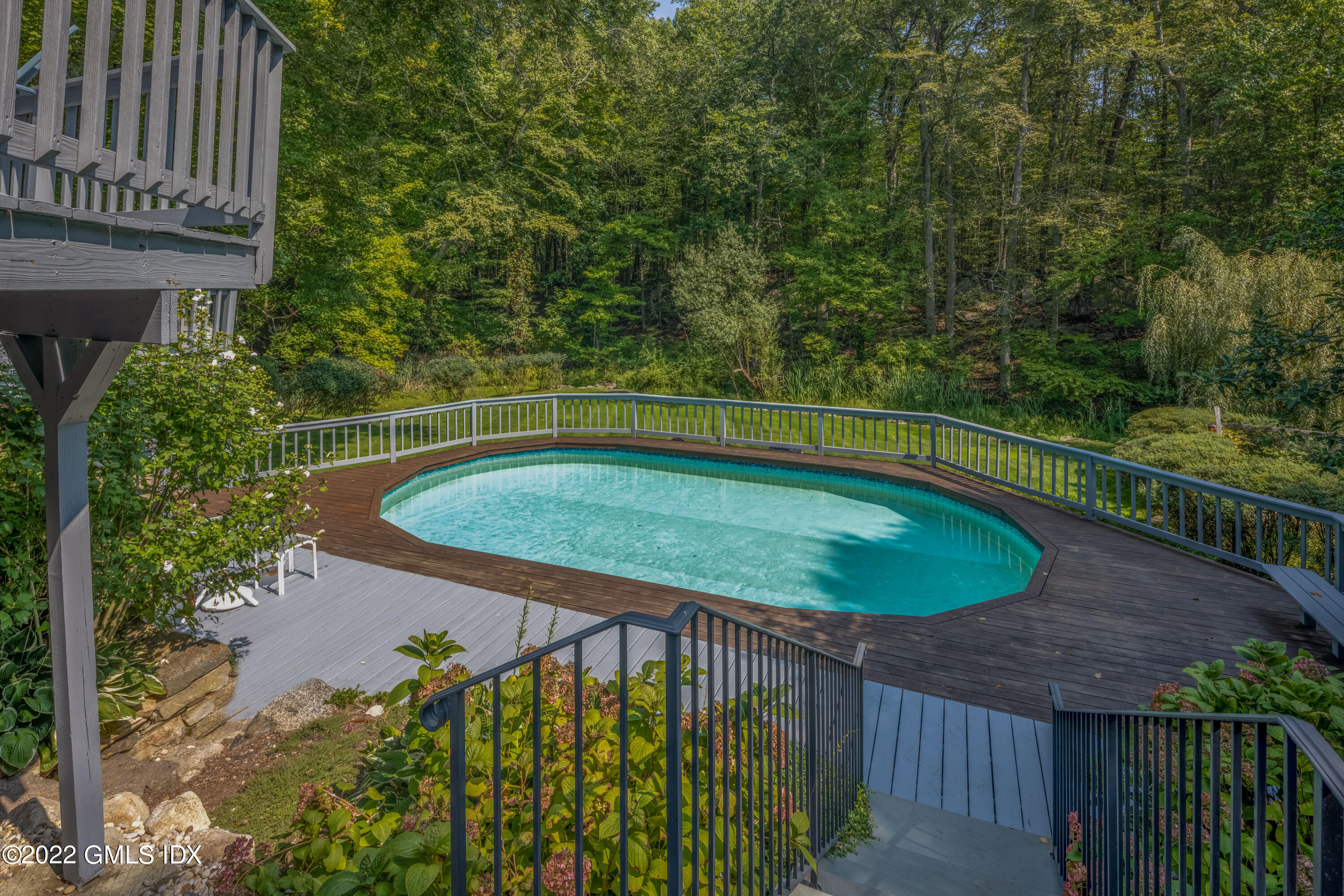 27 Rustic View Road Greenwich, CT 06830 - Photo 3 of 37 a view of a swimming pool with a patio