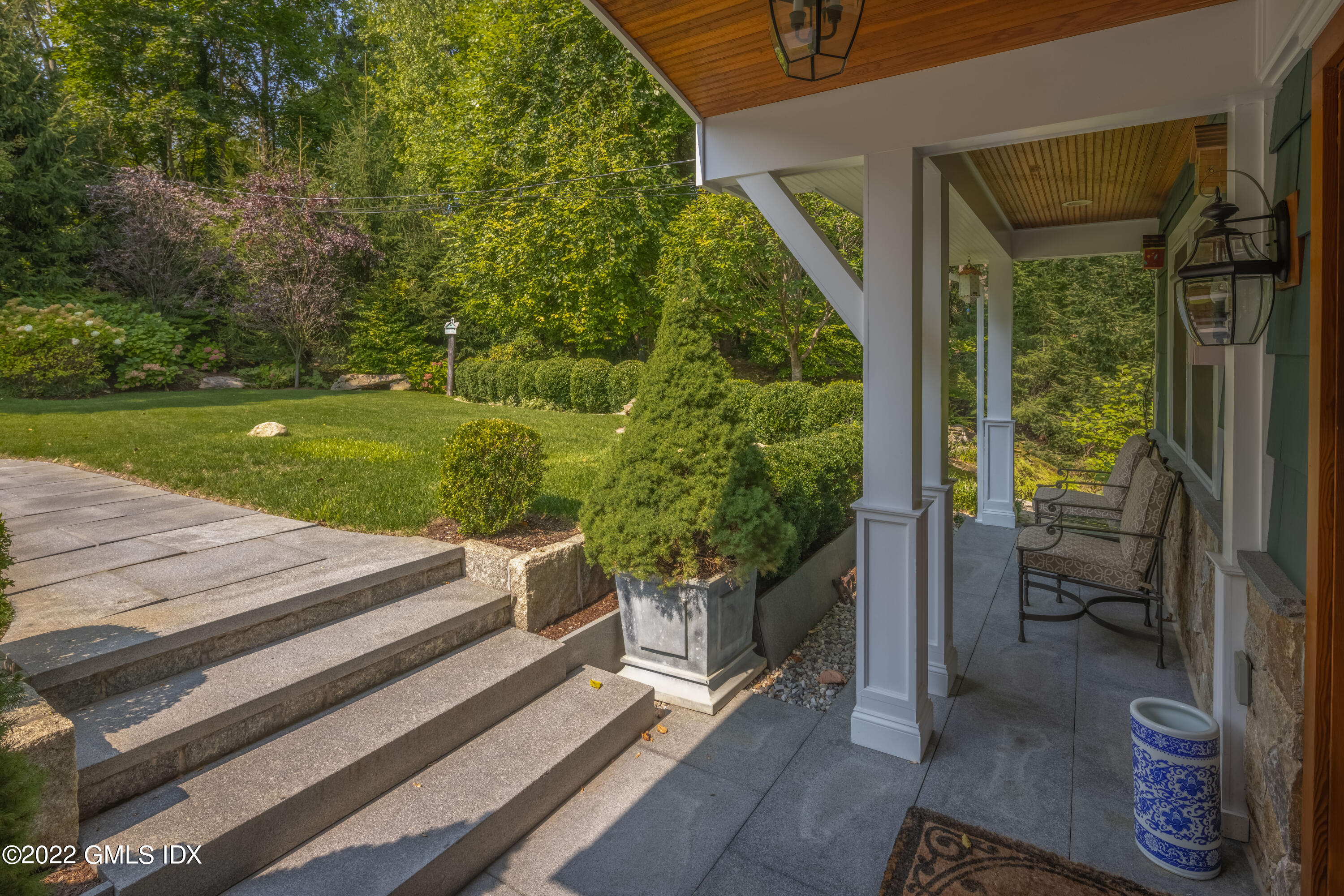 27 Rustic View Road Greenwich, CT 06830 - Photo 4 of 37 a view of a patio with table and chairs potted plants with bedroom view