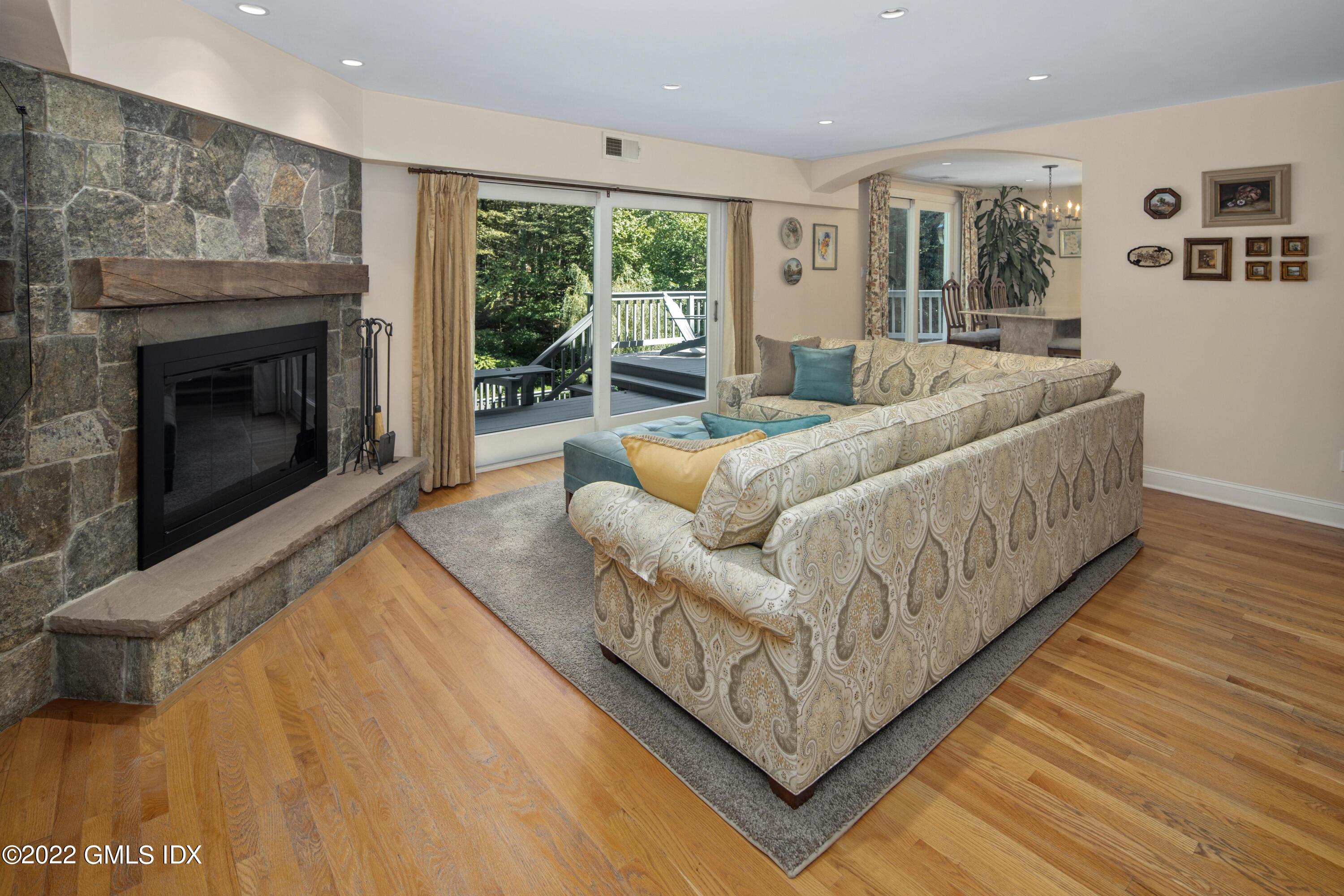 27 Rustic View Road Greenwich, CT 06830 - Photo 6 of 37 a living room with furniture and a fireplace