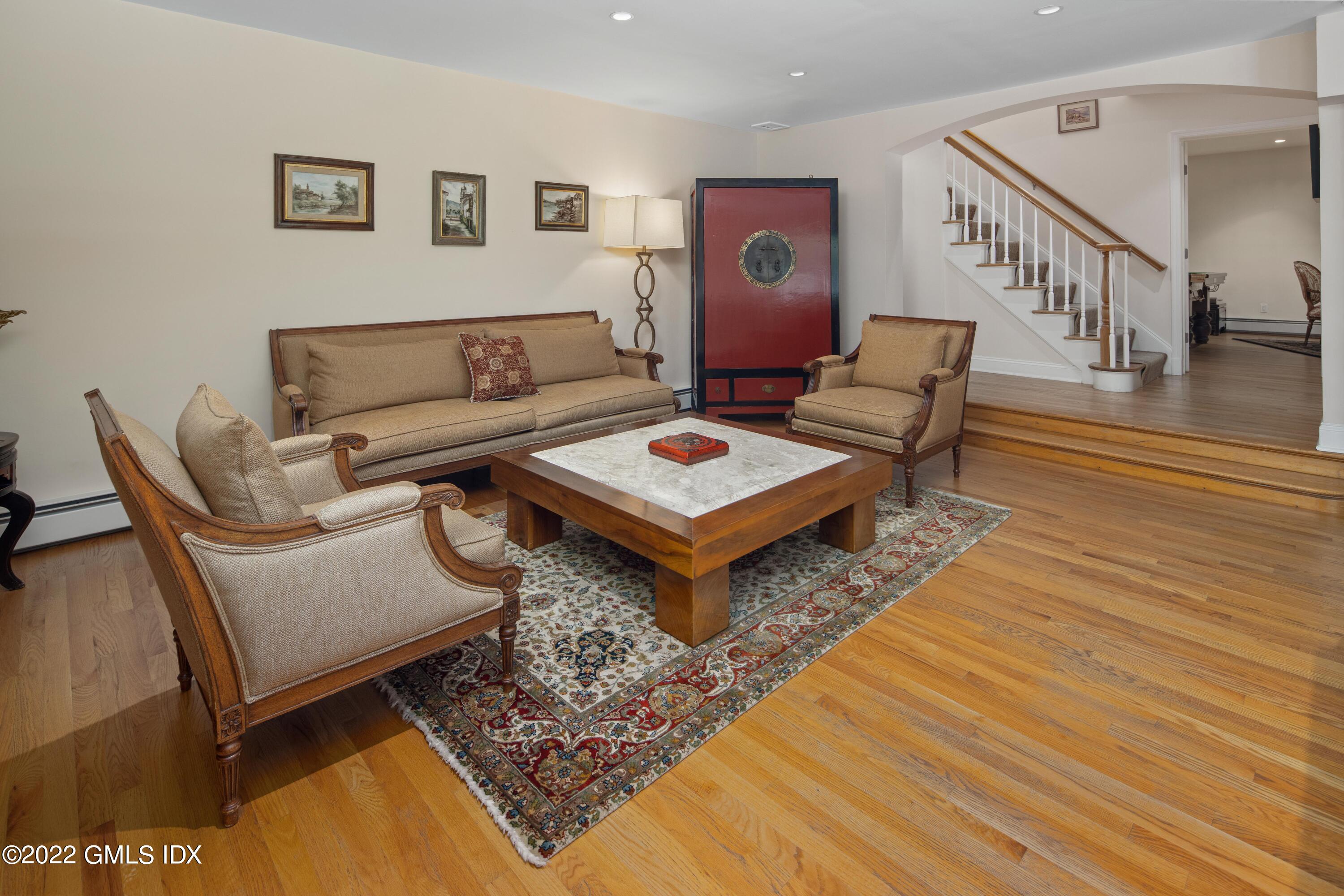 27 Rustic View Road Greenwich, CT 06830 - Photo 7 of 37 a living room with furniture and a rug
