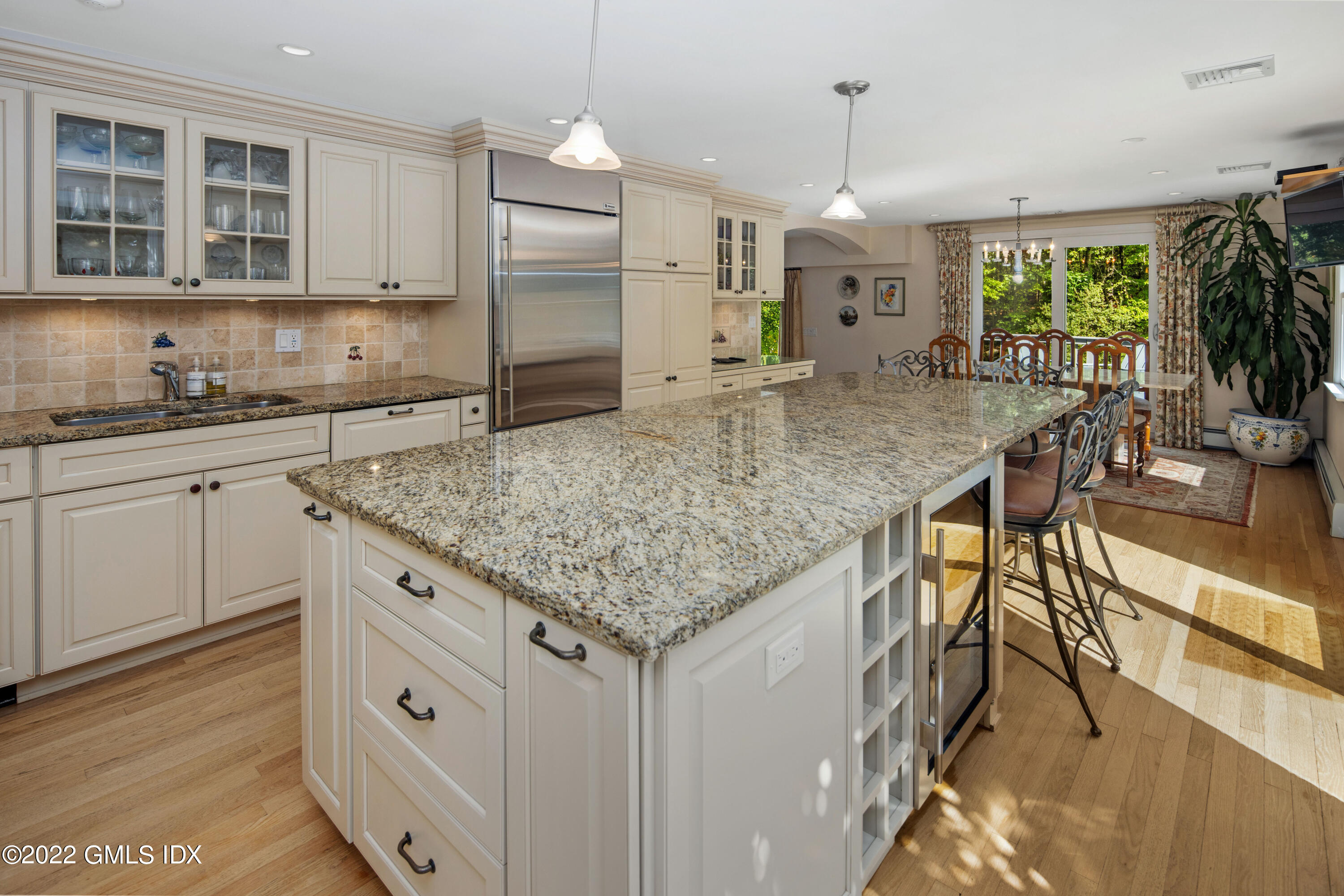 27 Rustic View Road Greenwich, CT 06830 - Photo 9 of 37 a kitchen with stainless steel appliances granite countertop a kitchen island a stove and a sink