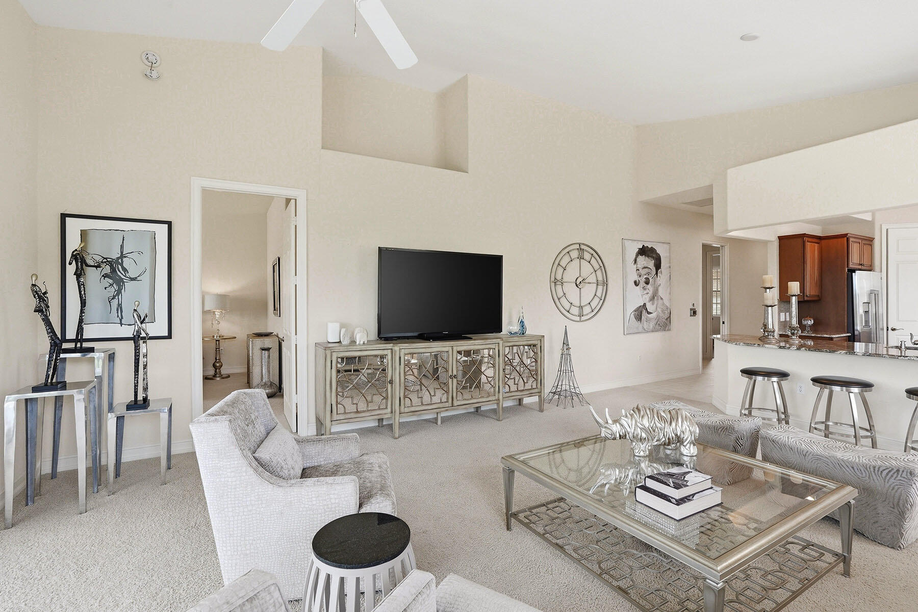8605 Champions Point, Unit 103 Naples, FL 34113 - Photo 19 of 44 a living room with furniture and a flat screen tv
