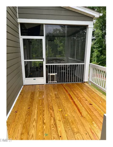 a view of balcony with wooden floor