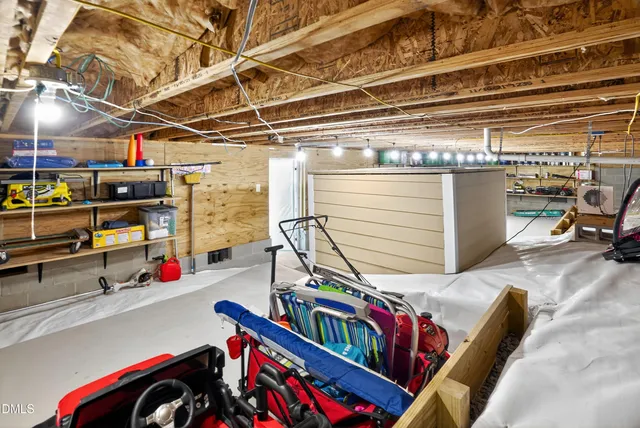 a storage and utility room with two washing machine