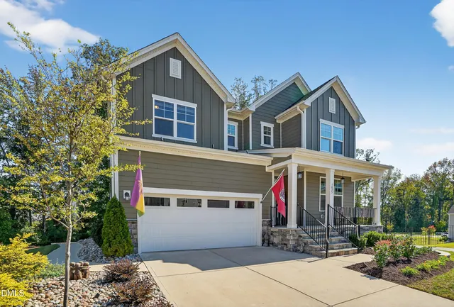 a view of a sign board with a yard