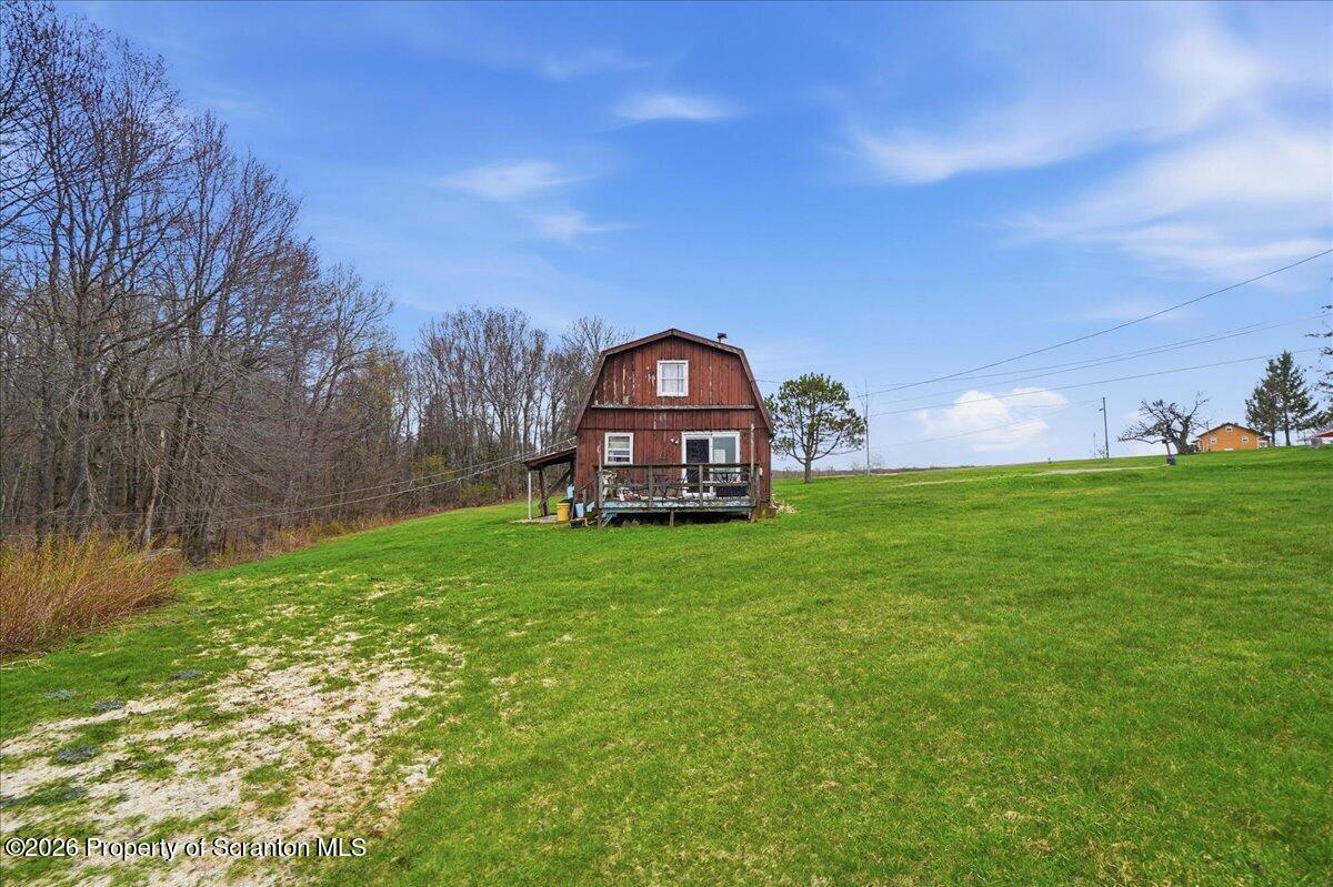 1140 Ball Pond Road Thompson, PA 18465 - Photo 48 of 68 a view of a tiny house with a big yard