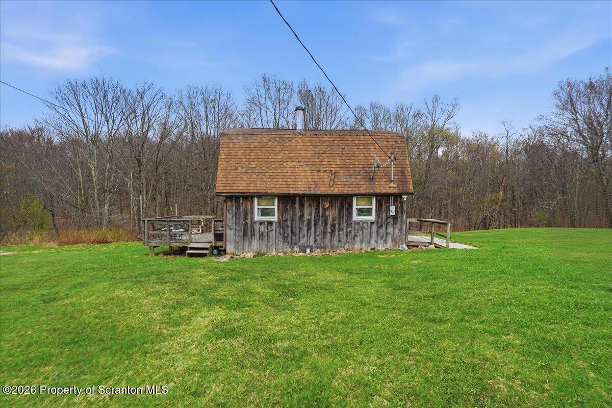 1140 Ball Pond Road Thompson, PA 18465 - Photo 50 of 68 a view of a house with backyard and sitting area