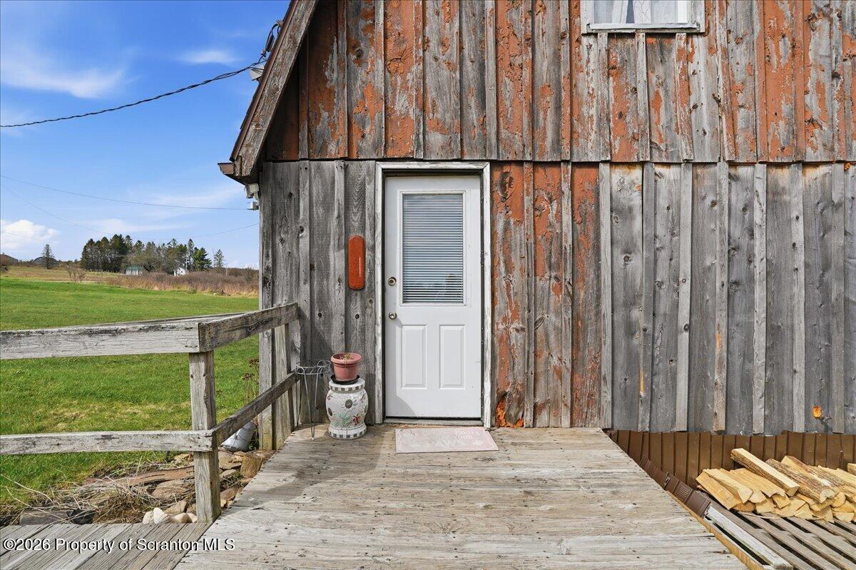 1140 Ball Pond Road Thompson, PA 18465 - Photo 54 of 68 a view of a balcony with an outdoor space
