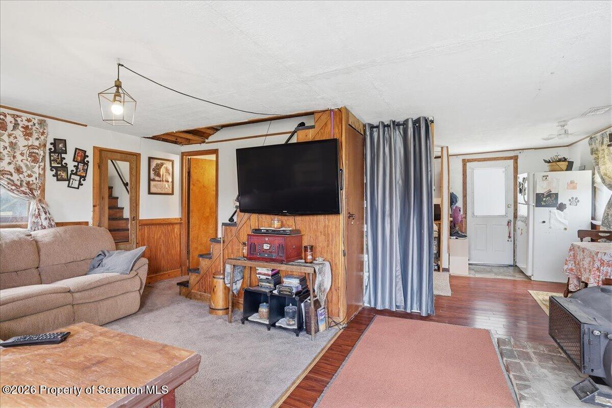1140 Ball Pond Road Thompson, PA 18465 - Photo 61 of 68 a living room with furniture and a flat screen tv