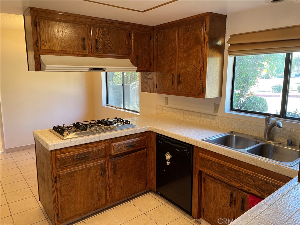 1110 Orange Avenue Monrovia, CA 91016 - Photo 9 of 14 a kitchen with a stove and a sink