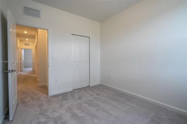 an empty room with a bathroom