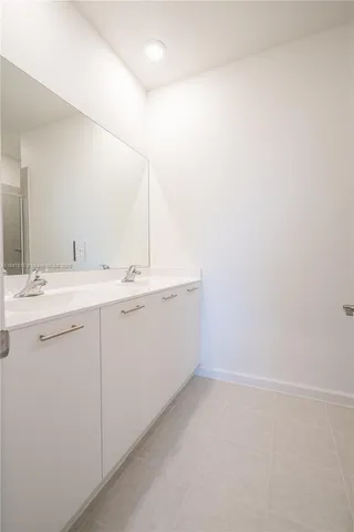 a utility room with a sink dryer and washer