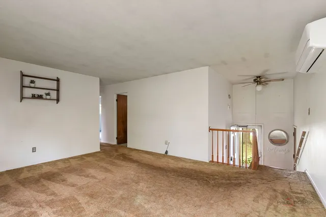 a view of a livingroom with a staircase