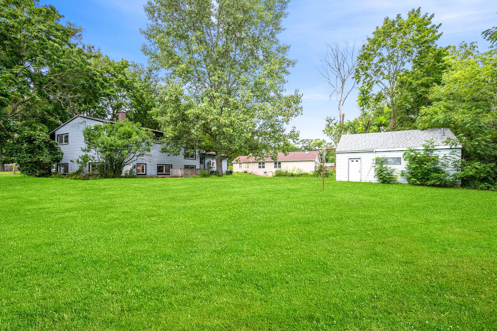 35663 North Helendale Road Ingleside, IL 60041 - Photo 20 of 28 a view of a house with a yard deck and a garden