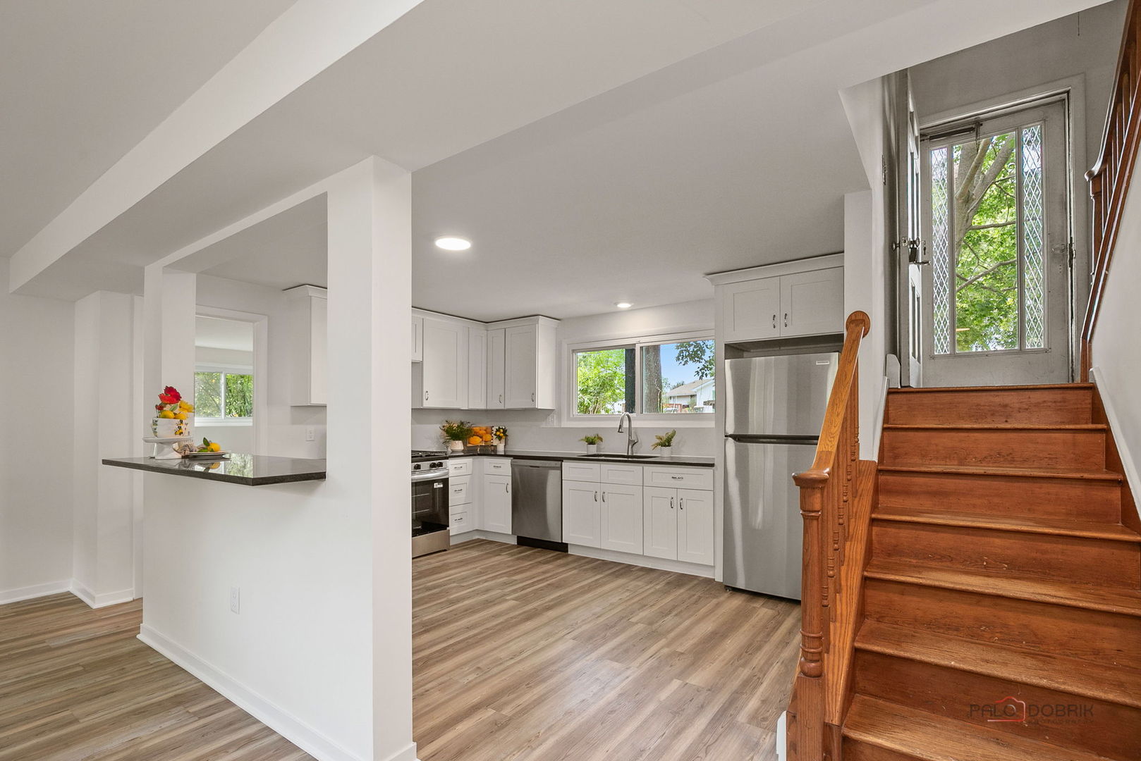 35663 North Helendale Road Ingleside, IL 60041 - Photo 2 of 28 a kitchen with sink cabinets and wooden floor