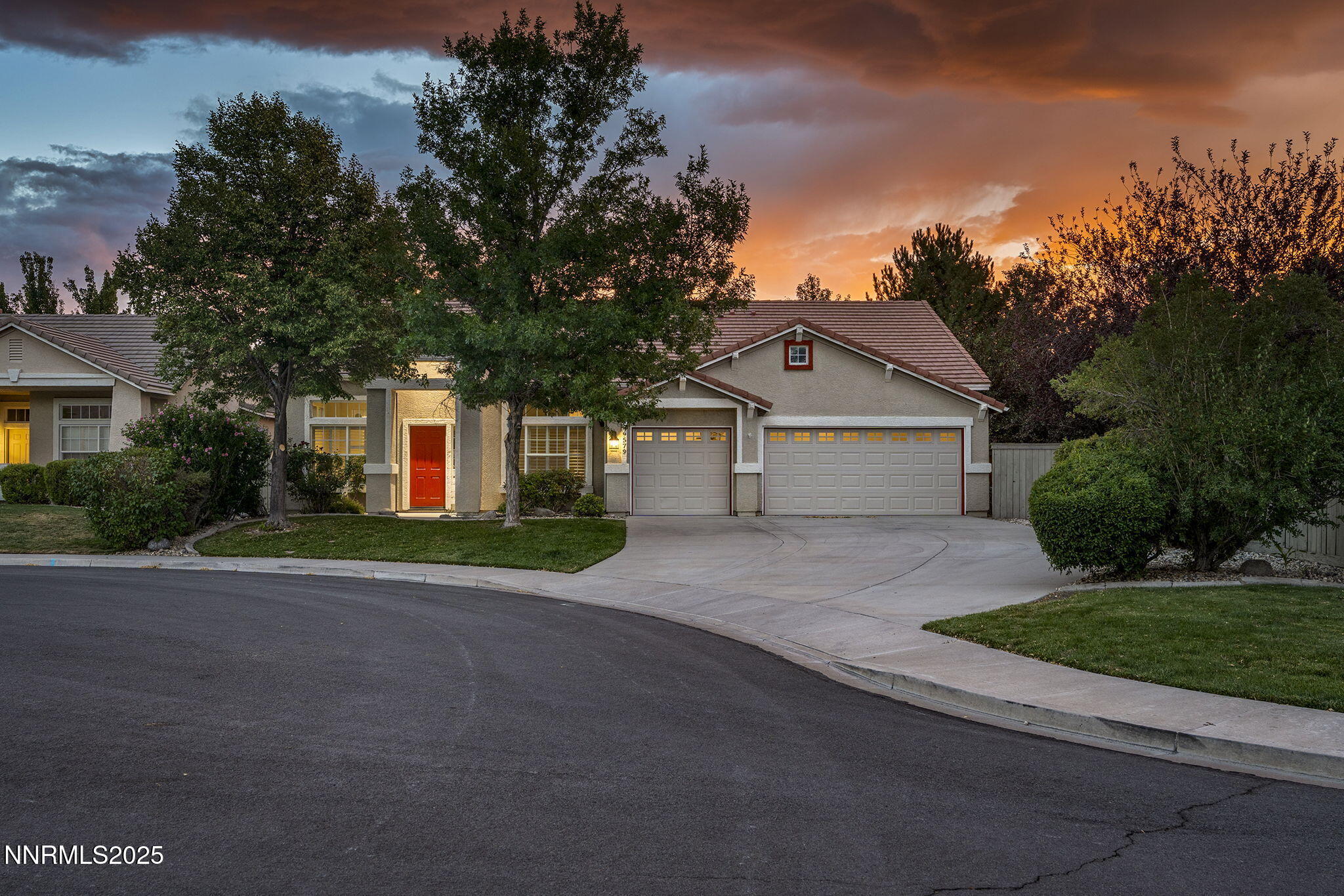 a front view of house with yard and green space