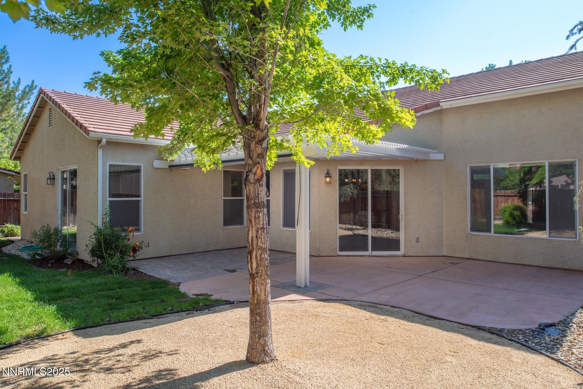 9579 Mammoth Court Reno, NV 89521 - Photo 25 of 39 a front view of a house with garden