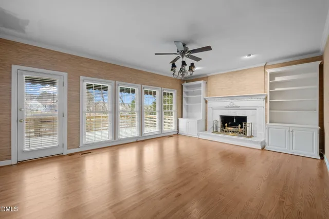 a kitchen with stainless steel appliances granite countertop a sink refrigerator and cabinets