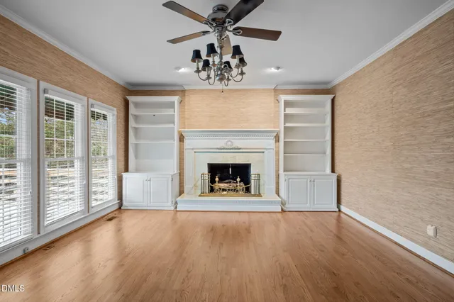 a large kitchen with stainless steel appliances kitchen island granite countertop a sink and cabinets