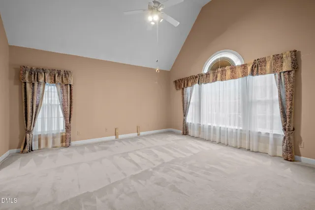 a bathroom with a granite countertop sink a mirror and a shower