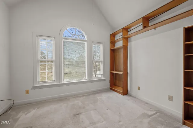 a view of a lake with a house in the background