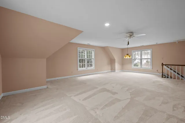 an aerial view of a house with a lake view