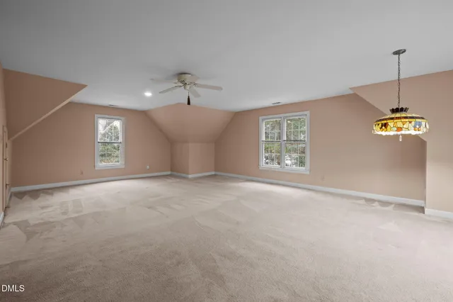 an aerial view of a house with a swimming pool