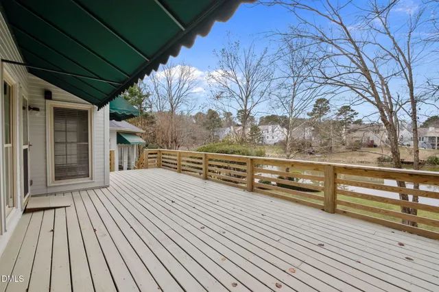 an aerial view of a house with a lake view