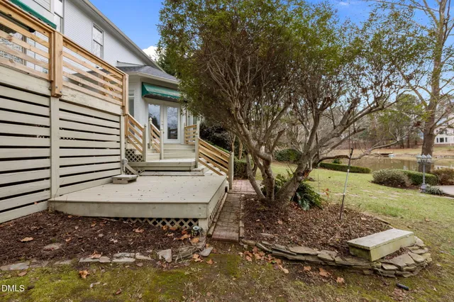 an aerial view of a house with outdoor space and lake view