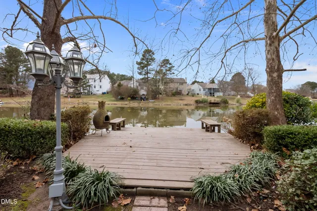 an aerial view of a house with a lake view