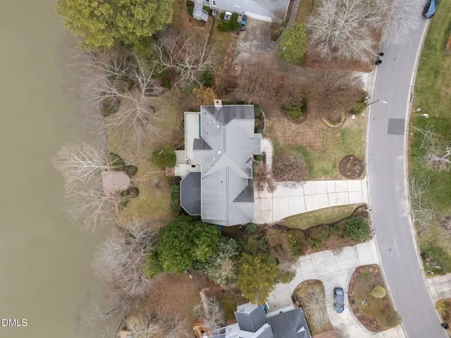 an aerial view of a house with a yard