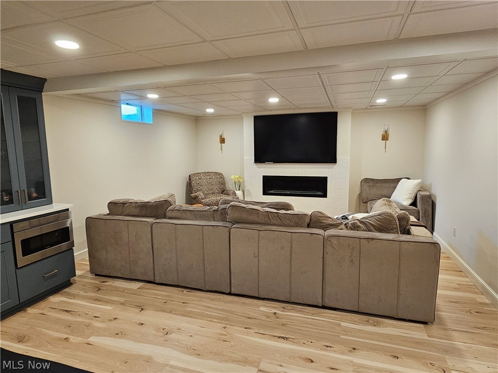 2363 Tabor Ridge Road Northeast New Philadelphia, OH 44663 - Photo 31 of 42 Finished basement featuring wood-finish flooring, recessed lighting, and a white coffered ceiling