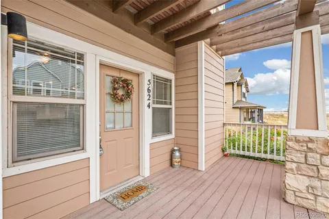 a view of front door of house with wooden floor