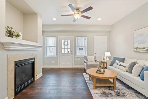 a living room with furniture and a fireplace