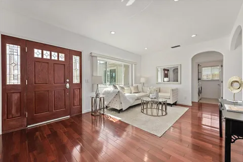 a living room with furniture and a table
