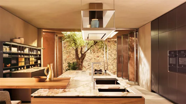 a living room with large window and furniture