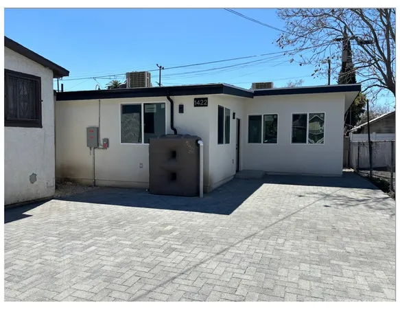 a view of house with backyard