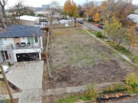 a view of a backyard with a patio and fire pit