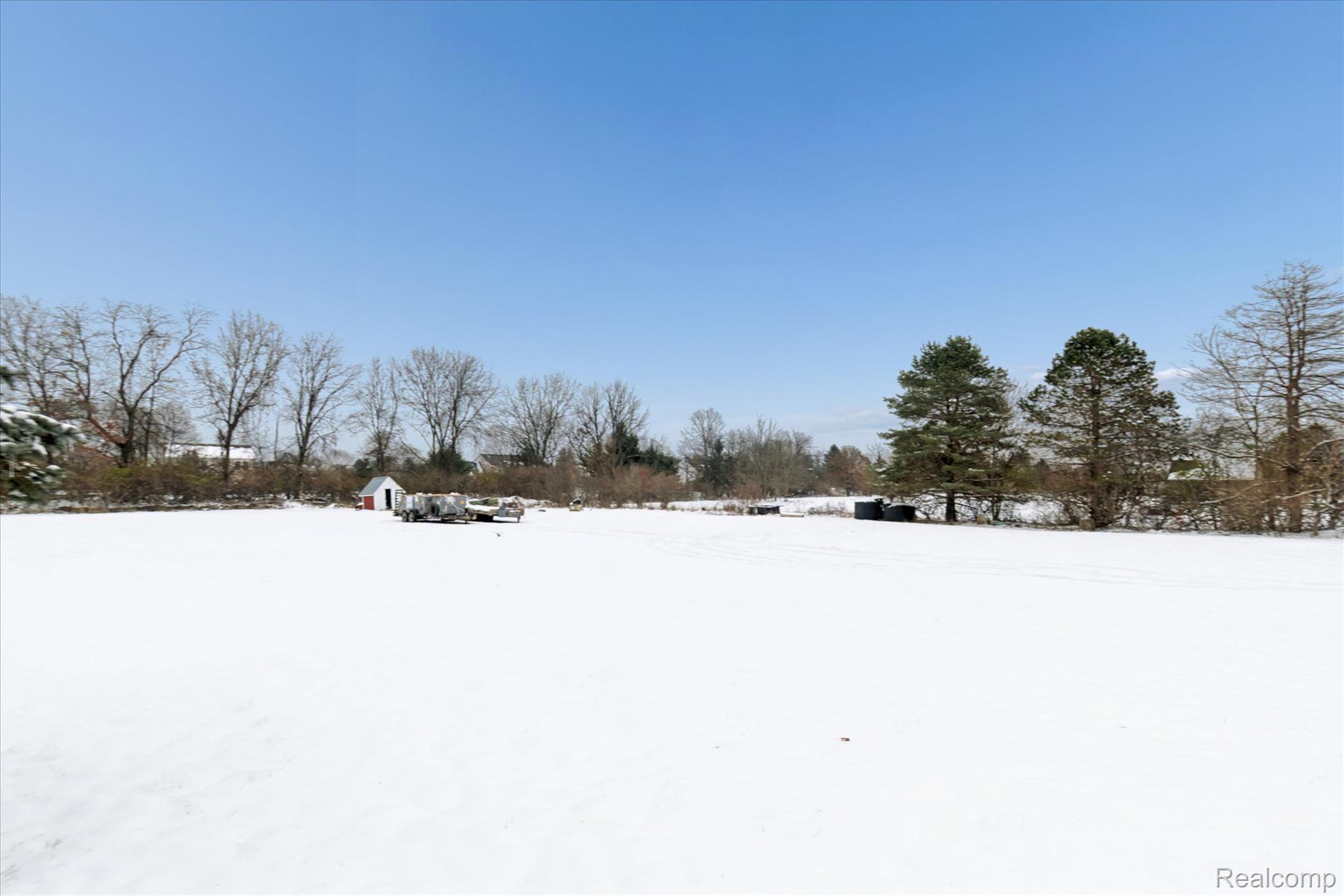 187 Darwin Road Pinckney, MI 48169 - Photo 57 of 71 View of 5.25 acre yard layered in snow