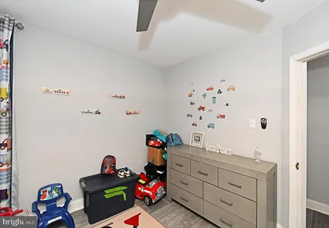 a bedroom with a bed and cabinets