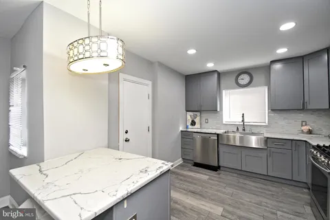 a kitchen with a sink and refrigerator